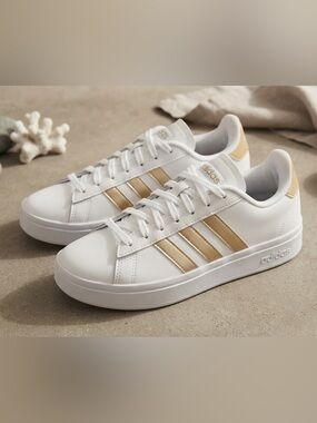adidas White Sneakers with Gold Stripes